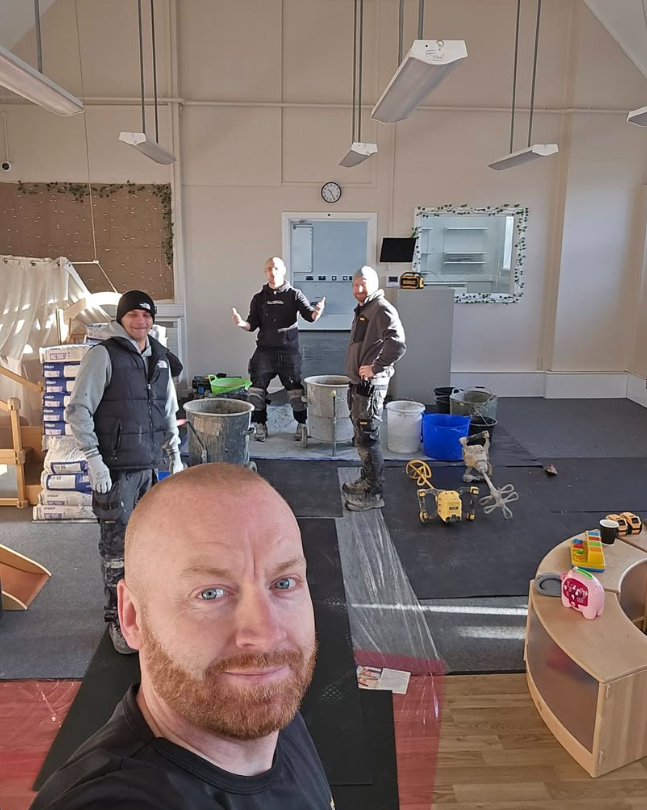 The Designer Flooring Ltd team with tools on an interior flooring fit-out