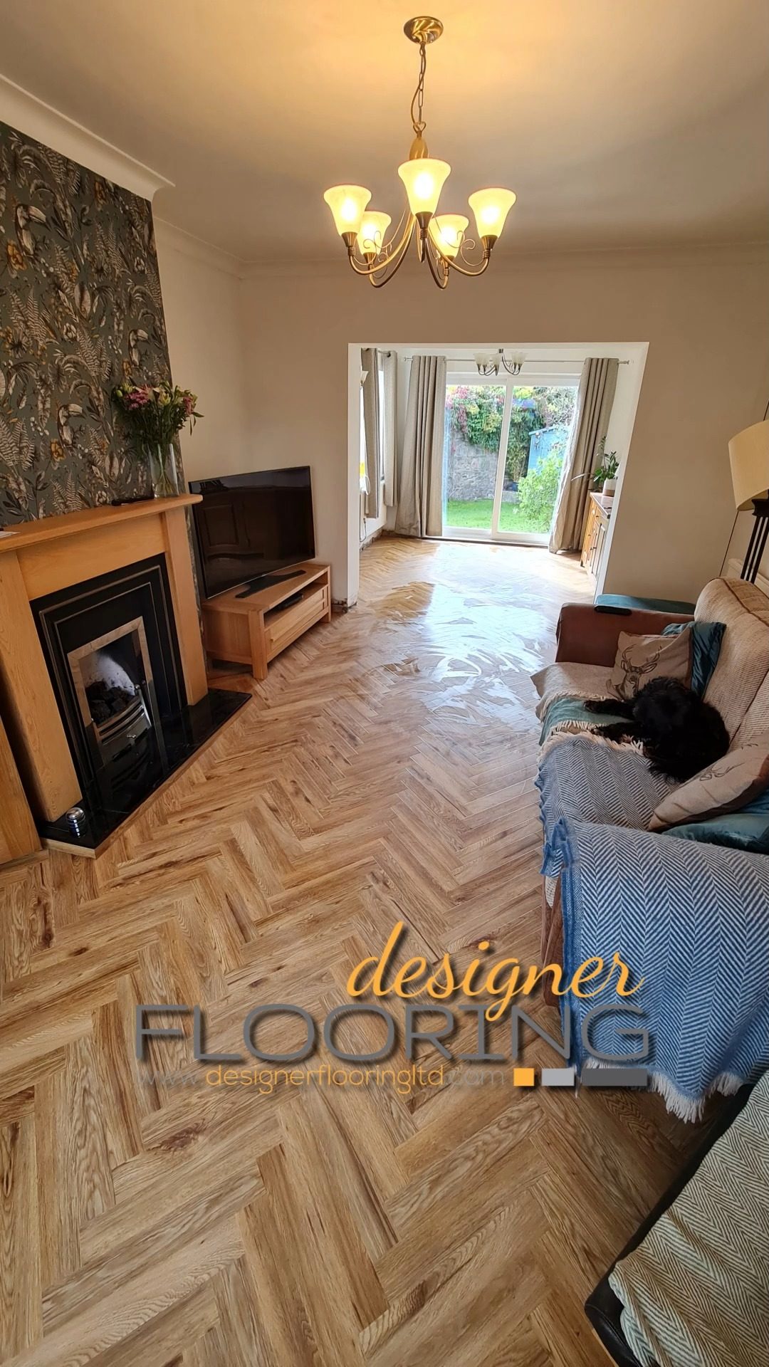 Natural-tone herringbone floor in a furnished living room