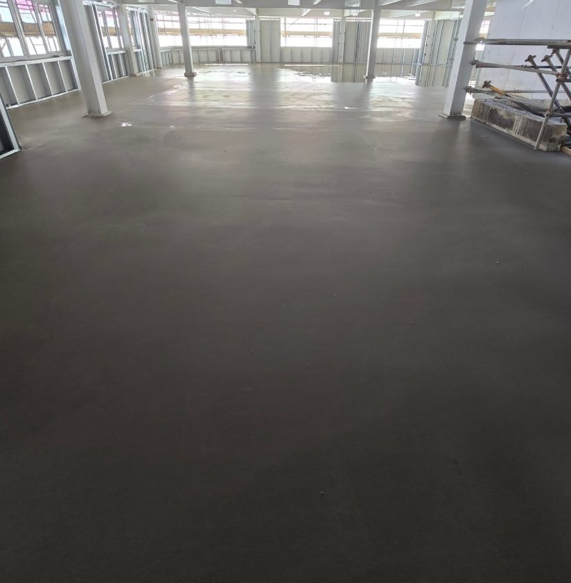 Smooth prepared subfloor across a large commercial interior